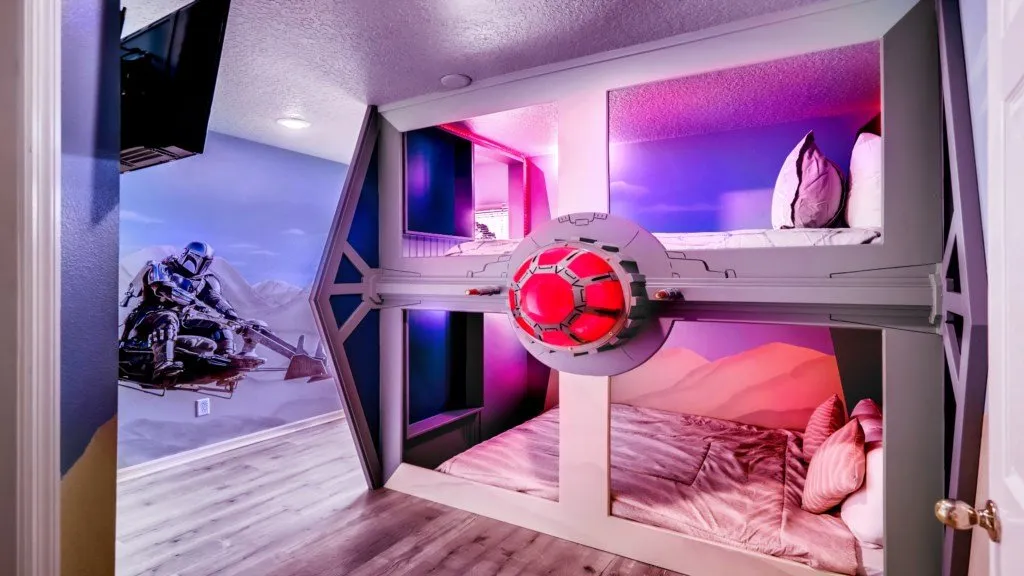 Star Wars Mandalorian themed bunk bedroom with TIE Fighter bed and character murals