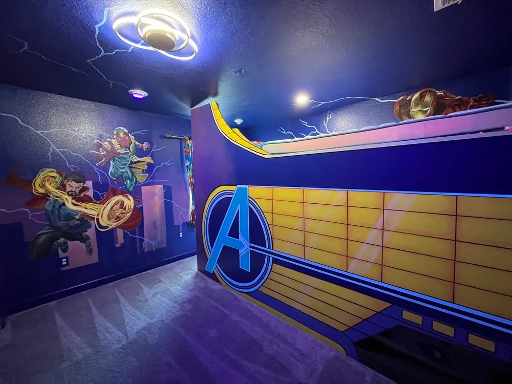 Avengers Marvel themed bedroom with Avengers bunk bed and character murals