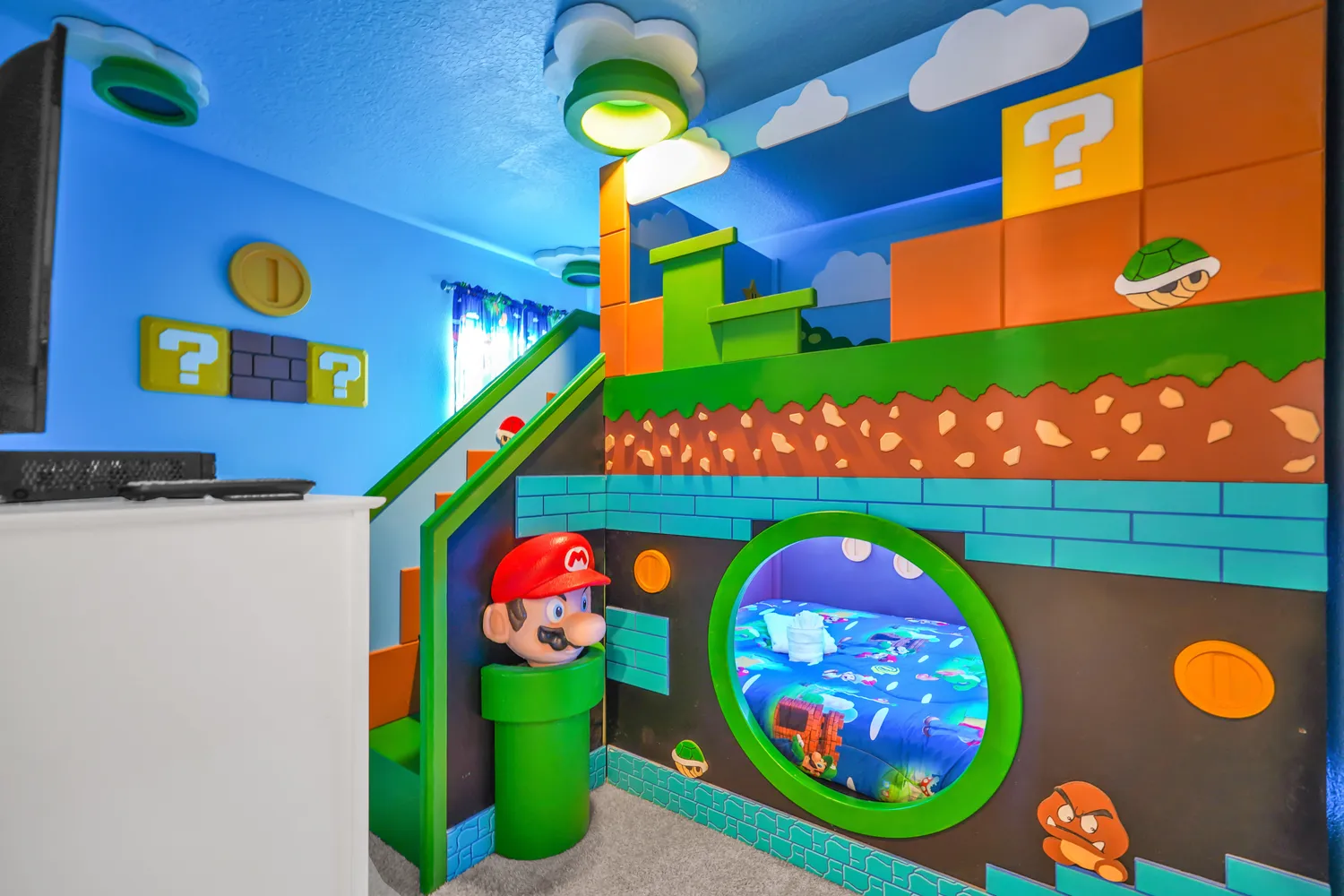 Super Mario Bros themed bedroom with custom pipe bunk bed, block murals, and full-room game-world design